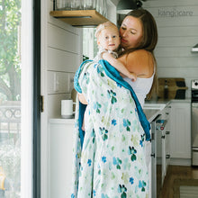 Load image into Gallery viewer, Mom and baby wrapped in a Clover Forever Blanket
