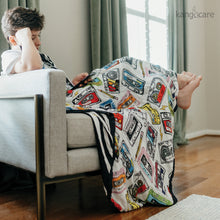 Load image into Gallery viewer, Child sitting with a Mixtape blanket
