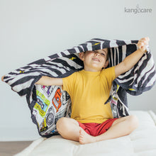 Load image into Gallery viewer, Child playing with a Mixtape Baby blanket on their head
