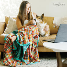 Load image into Gallery viewer, Person and dog sitting with a Quinn Forever Blanket

