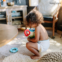 Load image into Gallery viewer, Toddler playing in a Kanga Care Prefold

