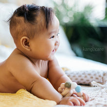 Load image into Gallery viewer, Baby holding a Moss Teething Ring 
