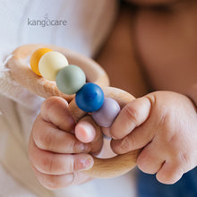 Load image into Gallery viewer, Rainbow Teething ring in a baby&#39;s hands
